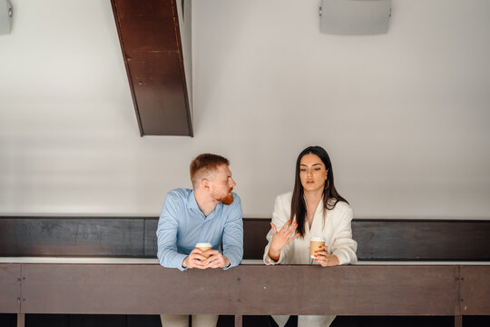 Coworkers discussing business ideas during a coffee break