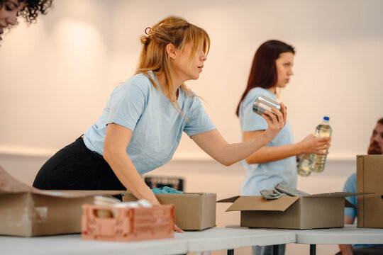 Volunteers packing food donations for charity work