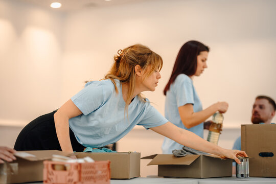 Volunteers sorting donated food for community charity