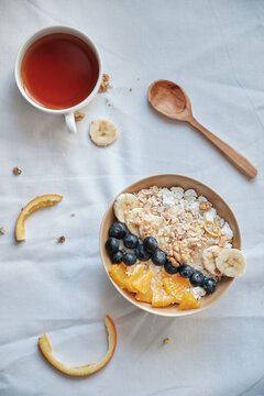 Healthy breakfast with oatmeal cereal, banana, blueberry, orange