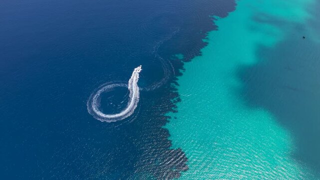 Speedboat carving a circular wake