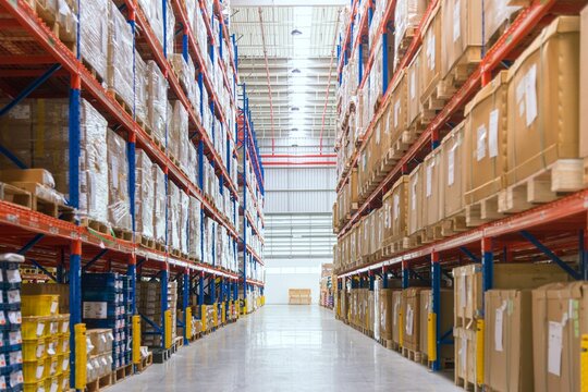Industrial warehouse storage racks filled with cardboard boxes warehouse logistics industrial shipping