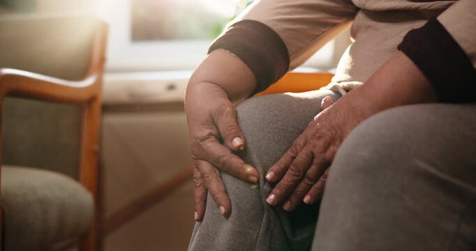 Arthritis, old woman or hands in house with knee pain, joint massage or discomfort in leg movement. Retirement, tendinitis and senior person with ache, chronic condition or sore muscle in lounge.
