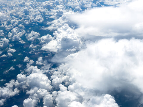 High-altitude view of clouds from airplane window