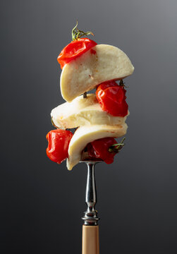 Mozzarella and roasted red cherry tomatoes.