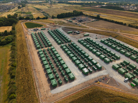 Aerial view close up of green lithium ion phosphate BESS battery units for grid resilience