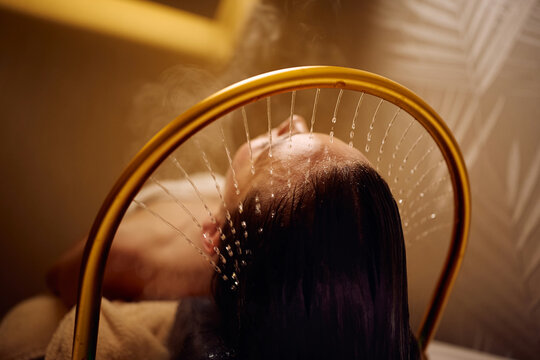 Close up of woman enjoying during Japanese head spa treatment.