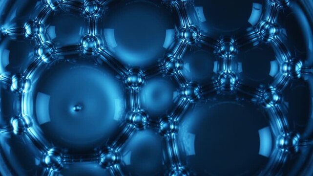 Ultra macro blue liquid bubbles in motion creating an abstract cellular network inspired by science and biotechnology.