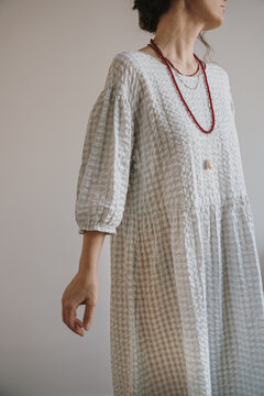 Elegant Female in Blue Checkered Outfit with Jewelry