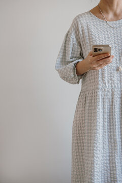 Casual Outfit with Smartphone in Hand
