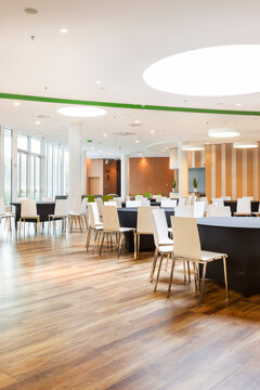 Empty modern hotel restaurant interior with tables in Warsaw