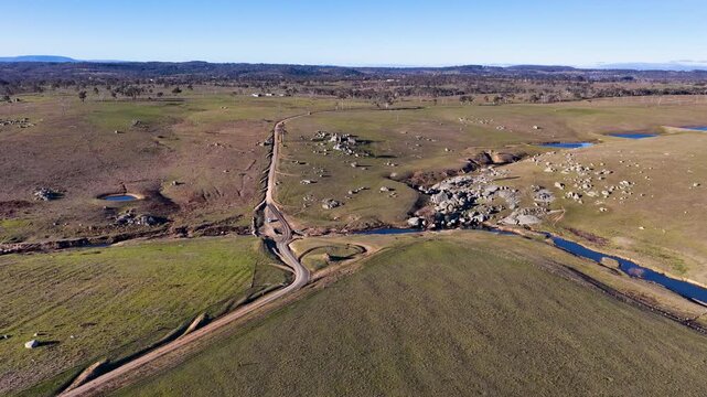 Aerial View of Rural Dirt Road and Granite Boulders