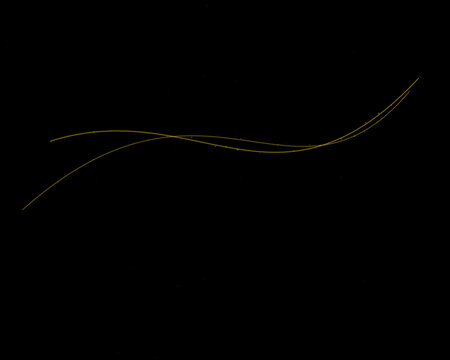 Abstract golden light waves with glowing particles flowing on a dark black background for elegant design and modern graphic art