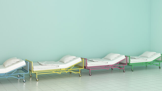 Row of colorful hospital beds in a light green room
