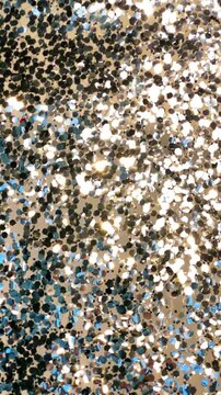 Static silver sequin background sparkling under moving light rays for festive design, luxury backdrop and party visuals