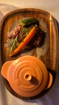 preparation of duck breast with mashed potatoes, gourmet presentation