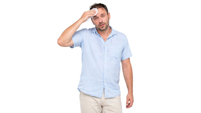 Middle-aged man wipes sweat from his forehead with a white towel due to the intense summer heat.