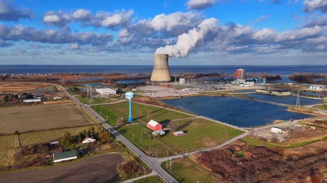 Aerial view of the Davis-Besse Nuclear Power Plant emitting steam from its cooling tower