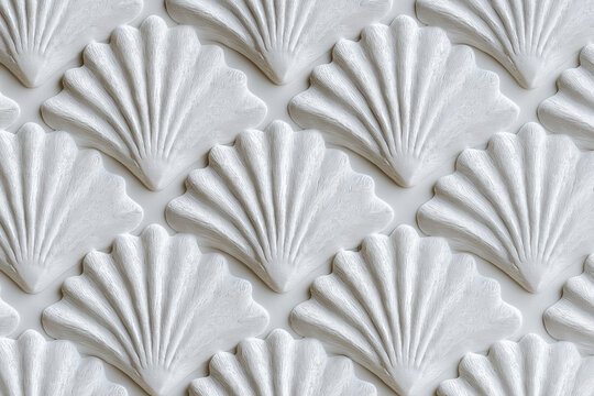 Close-up of a seamless embossed fan shell pattern on a white wall surface. Decorative shell motif, texture and minimal interior design themes for architecture, wallpaper, background, art deco.