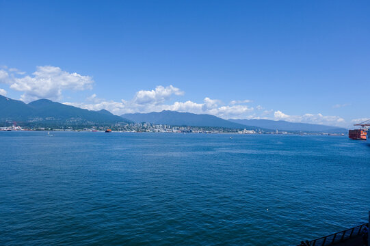 Float Planes Moored at Vancouver Harbour Flight Centre with Stanley Park and North Shore Mountains in Vancouver, Canada