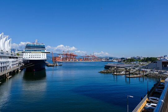 Float Planes Moored at Vancouver Harbour Flight Centre with Stanley Park and North Shore Mountains in Vancouver, Canada