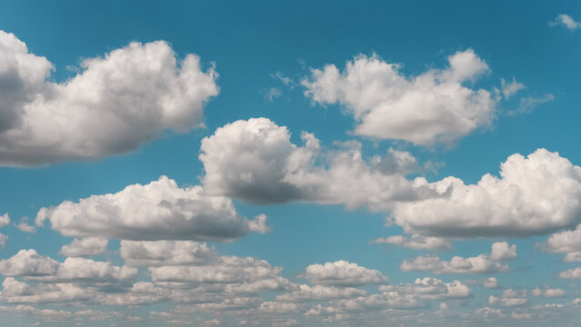 Cumulus clouds in the blue sky on a sunny day