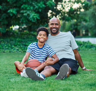 Portrait of father and son having fun outdoors in park or nature,, family life, parenting, love and bonding concepts