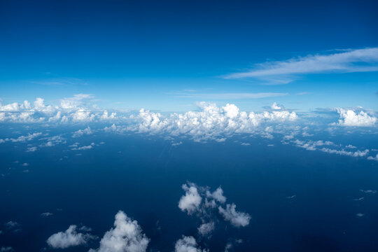 Aerial view of fluffy clouds over the Pacific Ocean in Polynesia