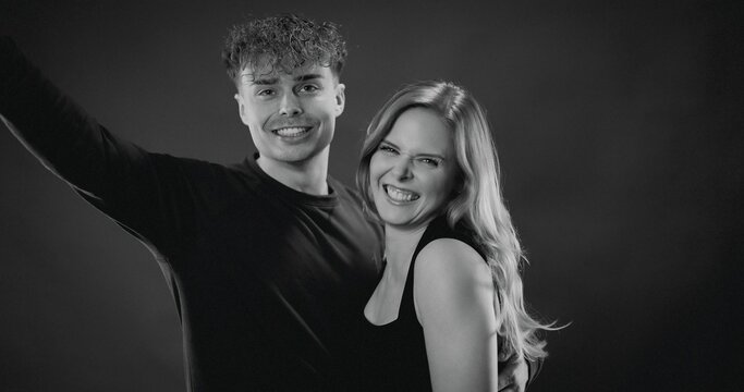 Young man and woman together laughing, expressing joy and unity