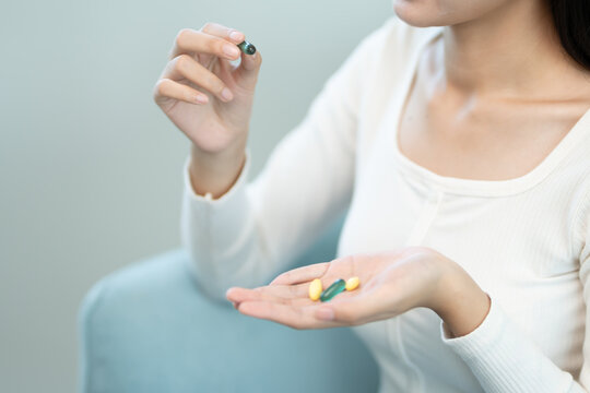 girl holding vitamin and take vitamin, medicine, strong, cure disease, sterilize, sedative, health care, Dietary supplement, medicine for medical treatment, tonic, daily dosage of vitamin