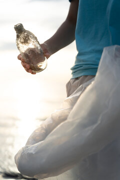 Save water. Volunteer pick up trash garbage at the beach and plastic bottles are difficult decompose prevent harm aquatic life. Earth, Environment, Greening planet, reduce global warming, Save world