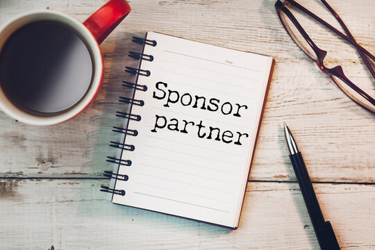white paper sign with sponsor partner message
