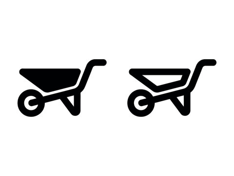 Two black wheelbarrows with one filled and one empty side by side