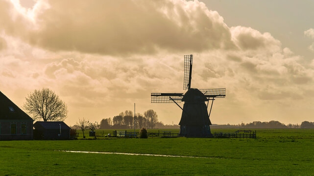 Dutch landscape with traditional drainage windmill in Polder Westerveer Spanbroek Netherlands rural heritage and water management