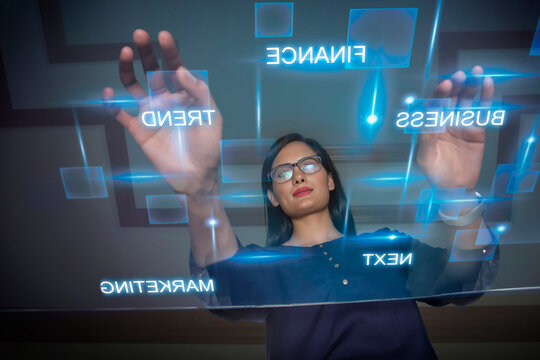 Businesswoman using futuristic computer keyboard