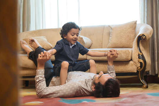 Father and son having fun at home