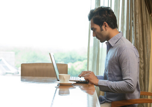 Man at laptop in home office