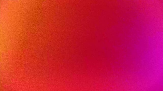 Abstract gradient motion background with vibrant red orange and pink colors mixing together in smooth fluid transitions creating soft aesthetic blurred visual effect for modern digital art.