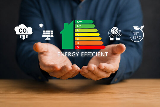 Energy efficiency concept. Person holding energy efficiency rating icon on virtual screen for energy efficient house building rate label audit. 