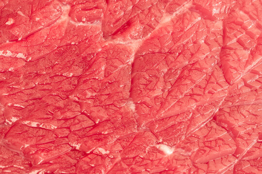 Raw beef steak macro pattern, red meat slice closeup