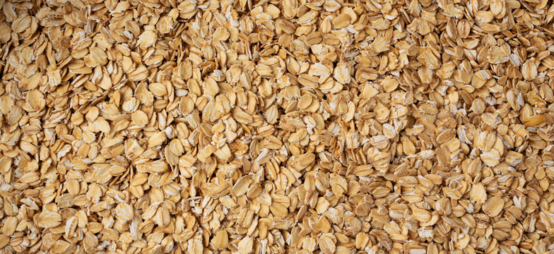 Oat flakes textured pattern, rolled oatmeal macro background