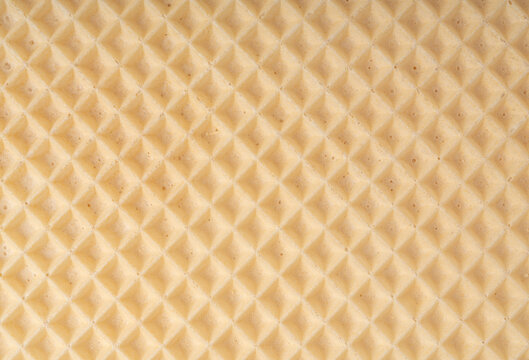 Waffle textured background, crispy wafer cake pattern