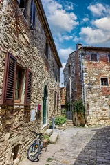 A picturesque street in the medieval village of Montefioralle, located in the famous Chianti wine region of Tuscany, Italy. T © Sergey