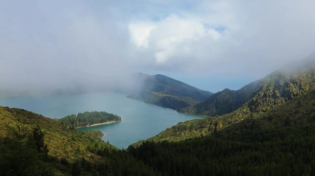 Lagoa do Fogo Sao Miguel island in Azores fog flying over the lake view from the mountain Portugal
