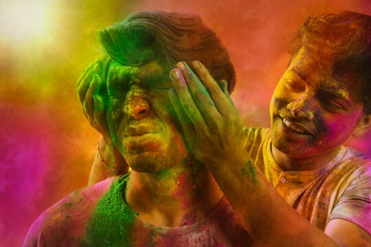 Young Indian men celebration Holi