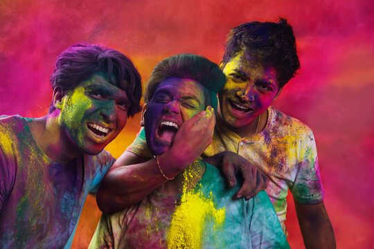 Portrait of Indian men playing holi