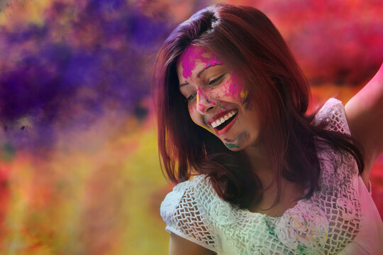 A Young Indian girl celebrating Holi festival