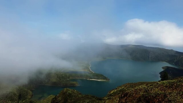 Lagoa do Fogo Sao Miguel island in Azores fog flying over the lake view from the mountain Portugal