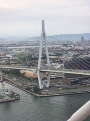 Fototapeta premium Cable-Stayed Bridge and Osaka Cityscape from Above, Japan