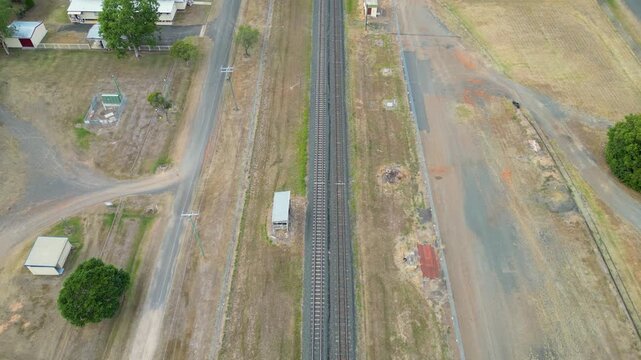 Overhead POV drone footage of a country rail line in Australia